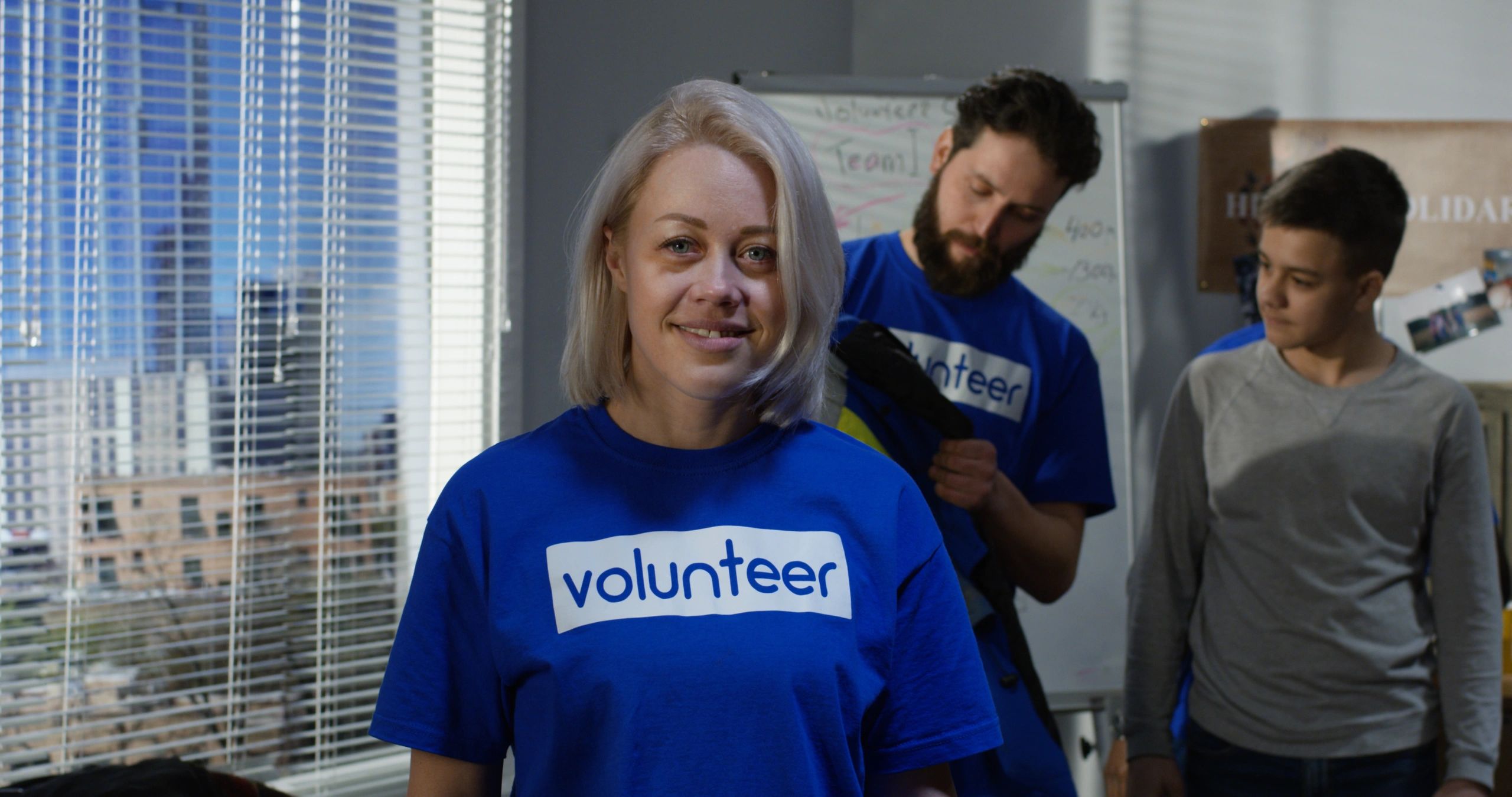 Person wearing branded polo shirt