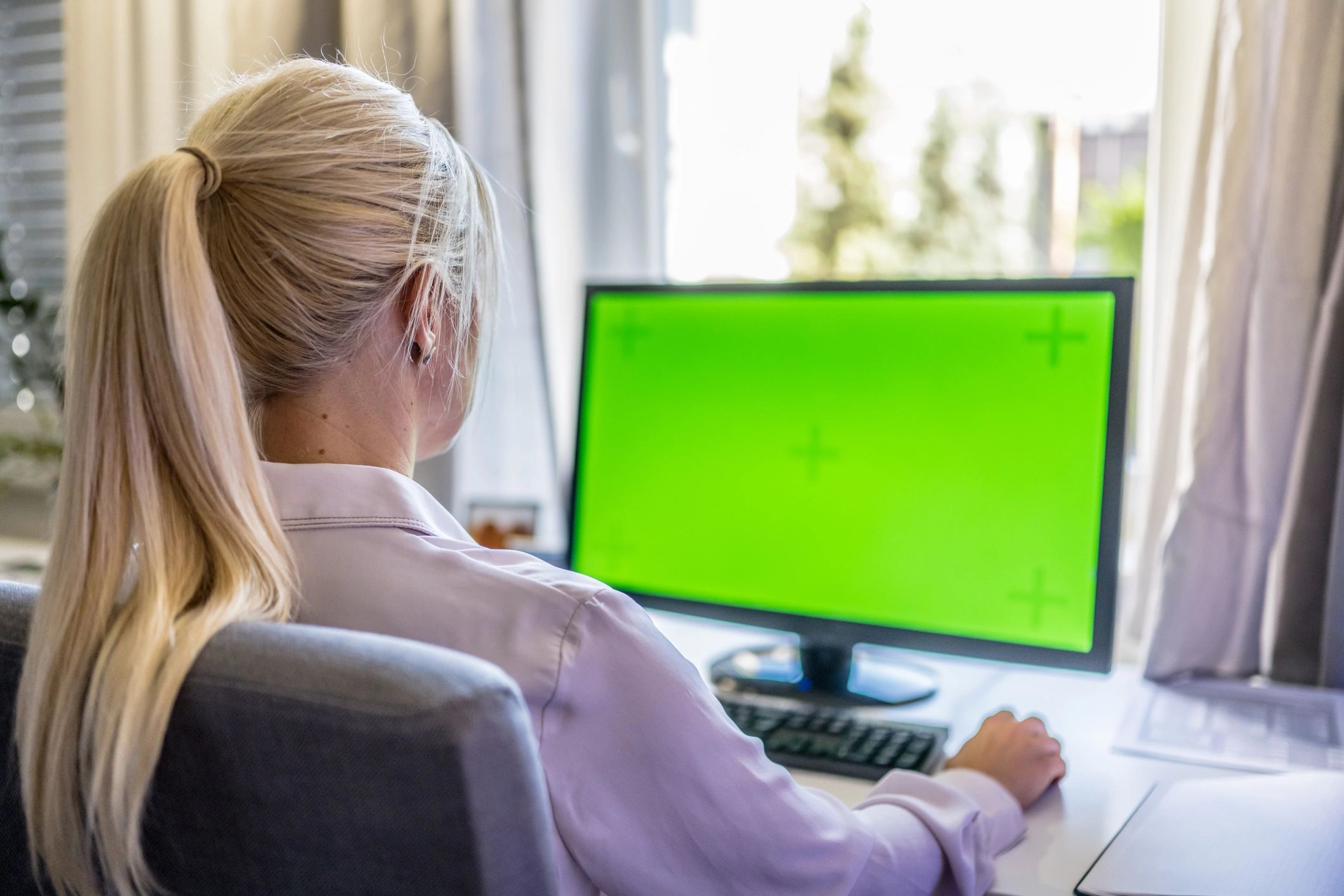 Designer creating logo concepts on computer