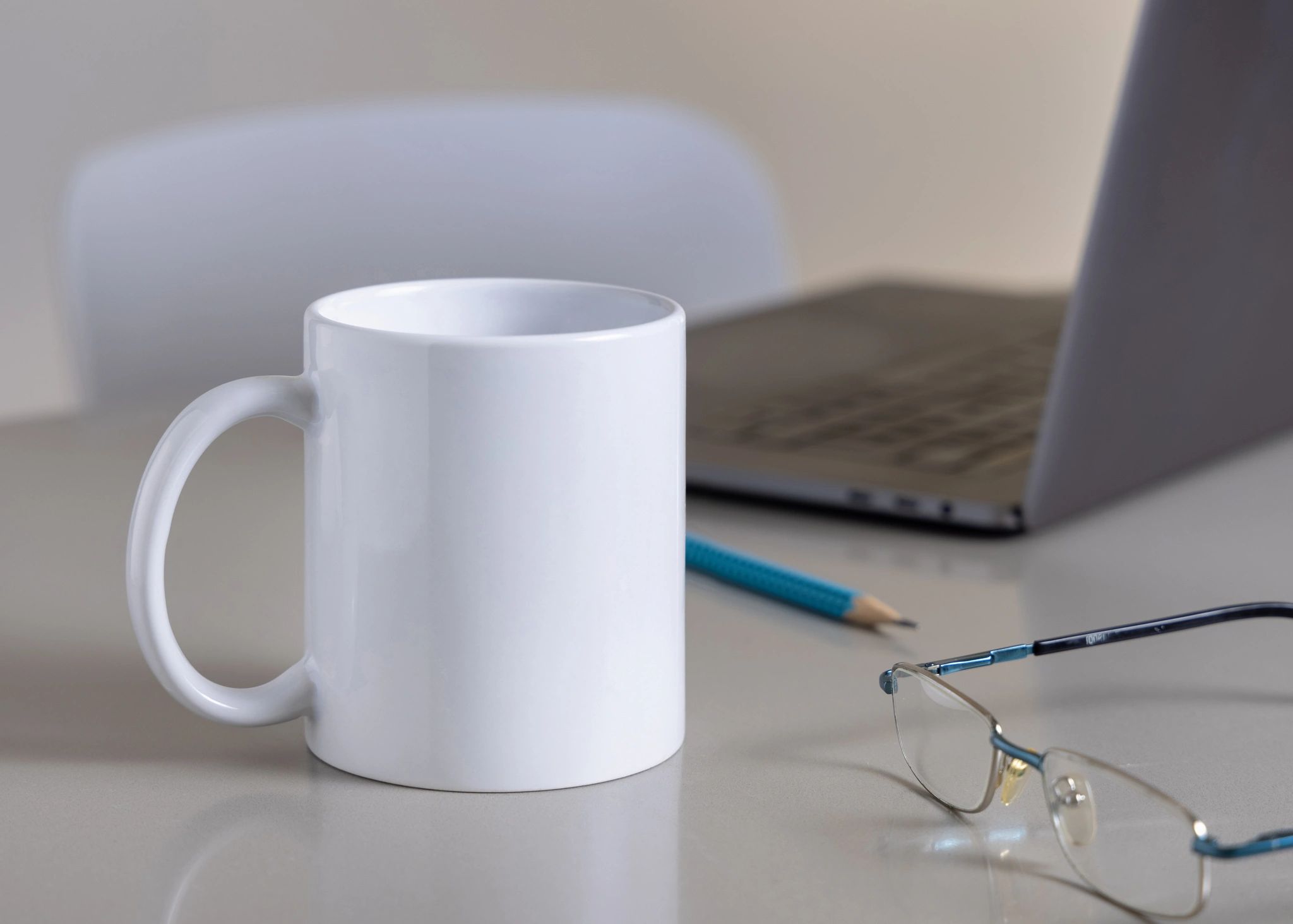 White branded coffee mug on office desk